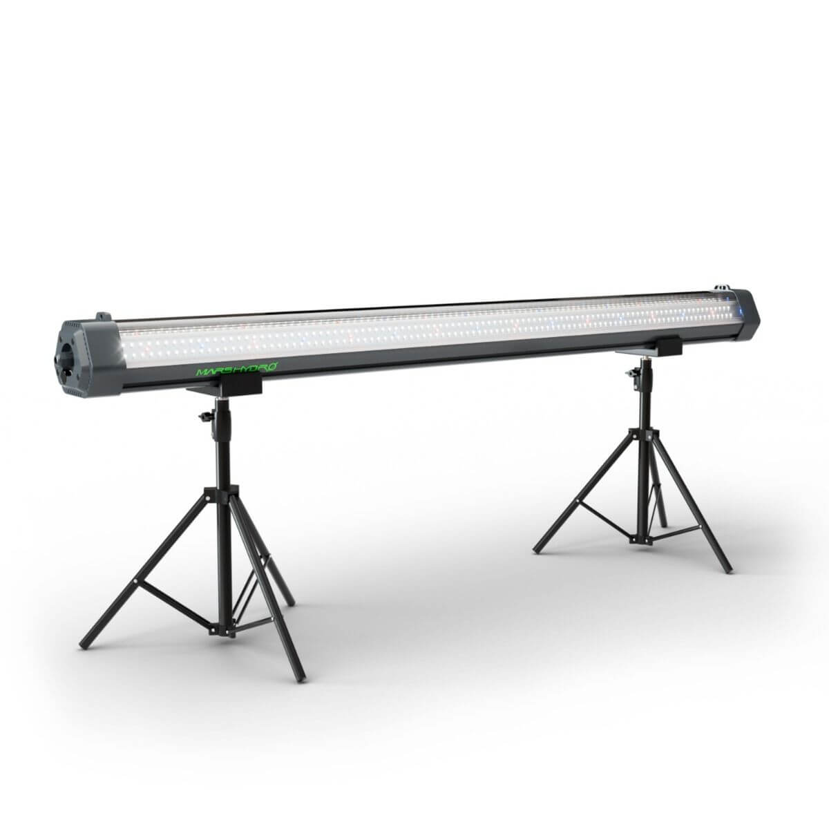 Mars Hydro ADlite-100 100W LED grow light on adjustable stands for indoor gardening and vertical farming.