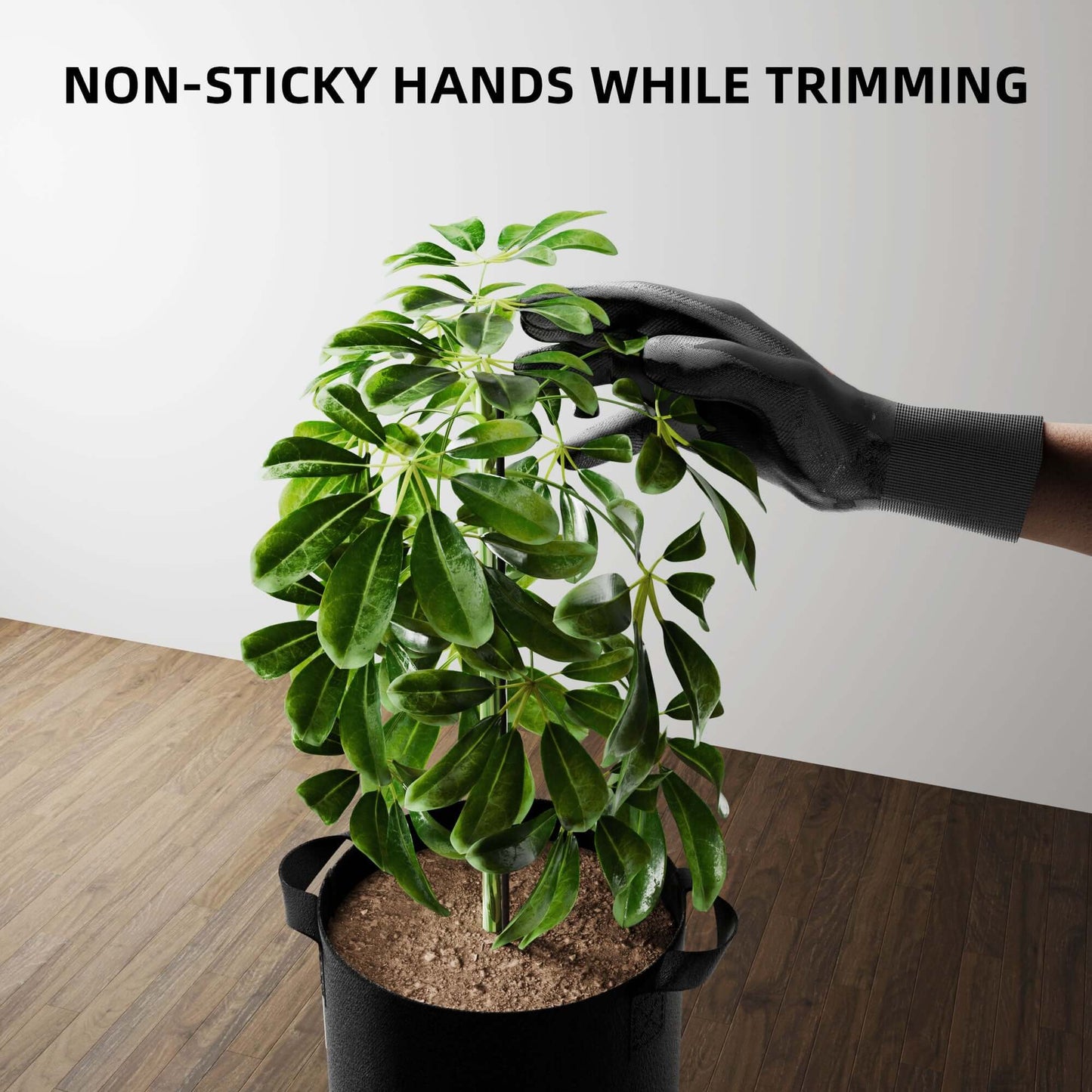 Gardening gloves providing non-sticky hands while trimming a healthy green plant in a pot.
